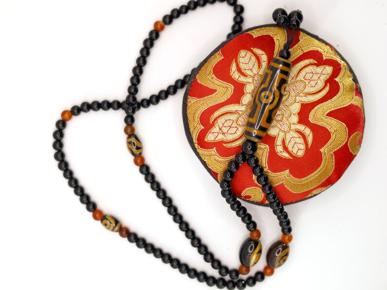 Amazing Seven Eye Dzi Beaded necklace. About a balanced life filled with blessings from the seven different aspirations in life.
