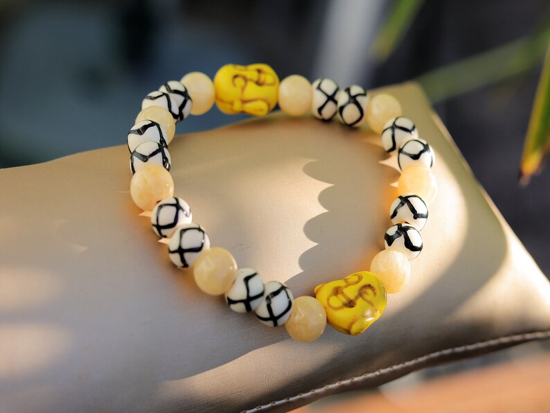 Topaz Jade Beads bracelet with Howlite bead Buddha yellow. absorb, and clear the constant stream of chatter from the mind. Haḍīāṁ
