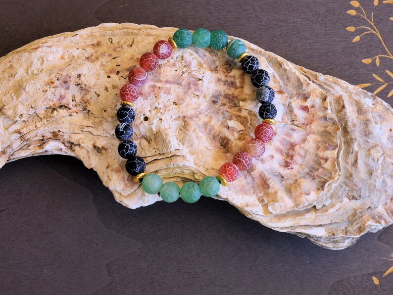 Top black,red and green Frosted Fire Crackle Agate bracelet with Tibetan Style Alloy Spacer Discs.The art of expressing your taste and style