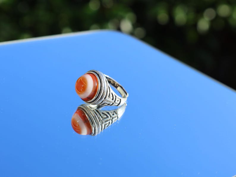 Handmade Tibetan Evil-Eye dZi Bead Ring. This ring is ideal for those seeking both style and spiritual protection.