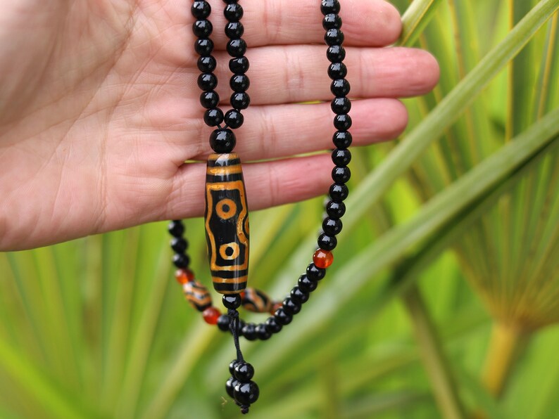 Amazing Seven Eye Dzi Beaded necklace. About a balanced life filled with blessings from the seven different aspirations in life.