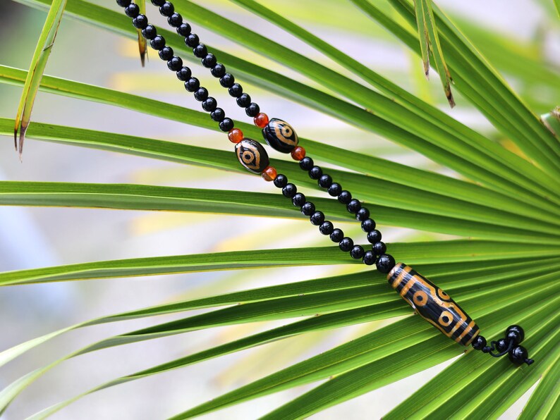 Amazing Seven Eye Dzi Beaded necklace. About a balanced life filled with blessings from the seven different aspirations in life.