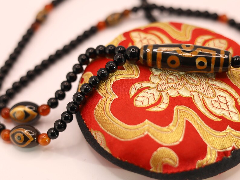 Amazing Seven Eye Dzi Beaded necklace. About a balanced life filled with blessings from the seven different aspirations in life.