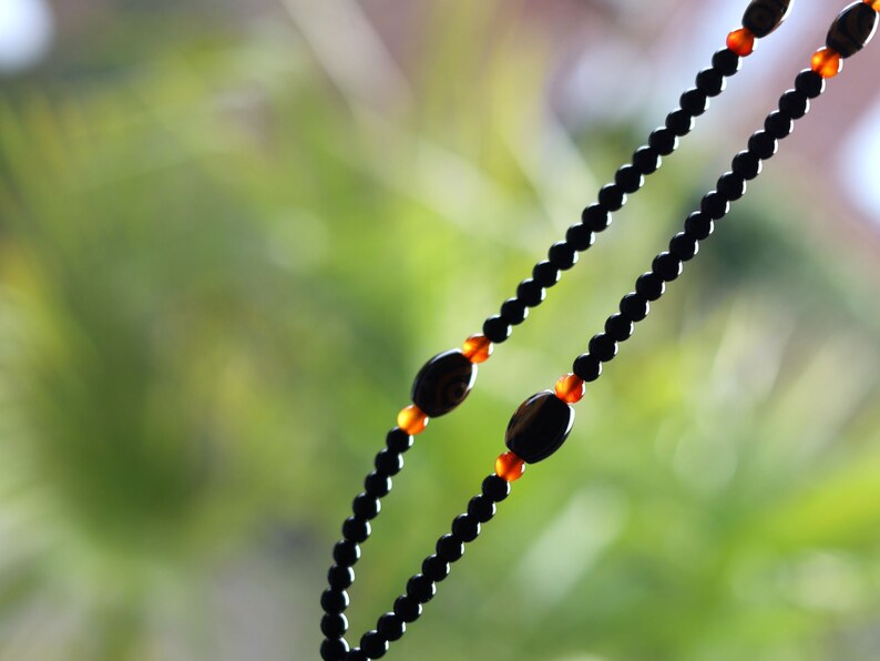 Amazing Seven Eye Dzi Beaded necklace. About a balanced life filled with blessings from the seven different aspirations in life.