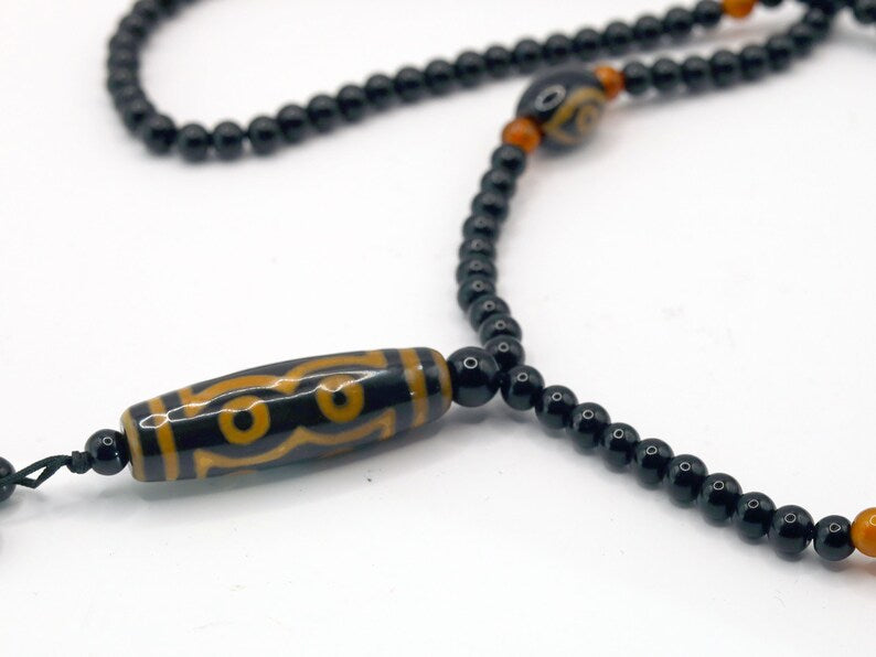 Amazing Seven Eye Dzi Beaded necklace. About a balanced life filled with blessings from the seven different aspirations in life.