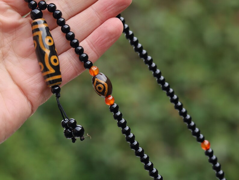 Amazing Seven Eye Dzi Beaded necklace. About a balanced life filled with blessings from the seven different aspirations in life.