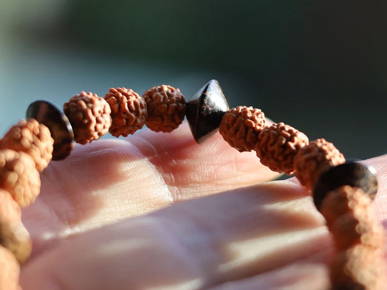 One of a kind Wajakaa bracelet! Round Rudraksha beads - made from the seeds of the Elaeocarpus Ganitrus tree. Combined +Patikan Palmwood