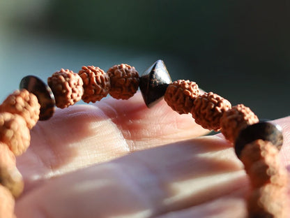 One of a kind Wajakaa bracelet! Round Rudraksha beads - made from the seeds of the Elaeocarpus Ganitrus tree. Combined +Patikan Palmwood