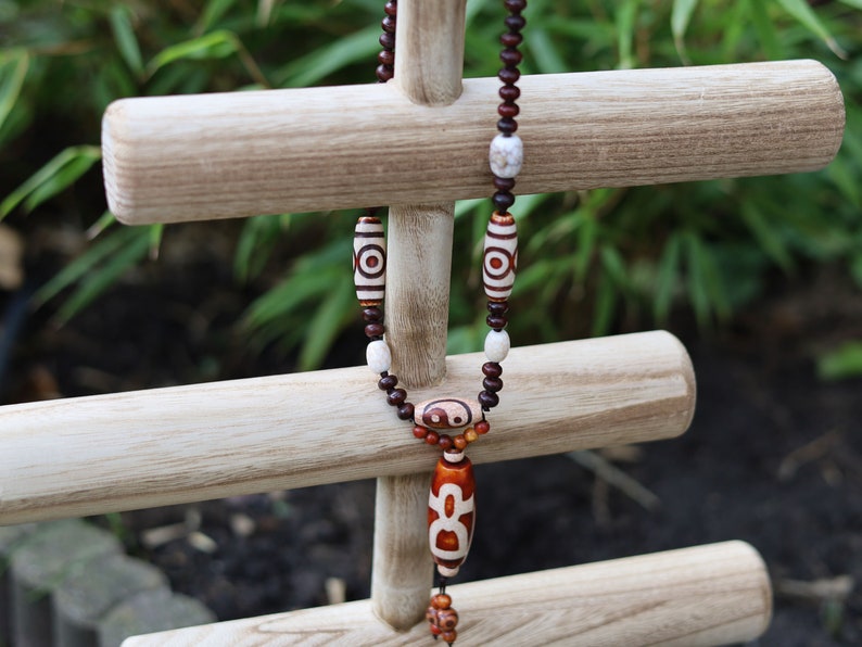 Big unique Wealth God Figure Dzi Bead bracelet combined with 4 eyes beads and Design. Perfect for having good vibes with style!