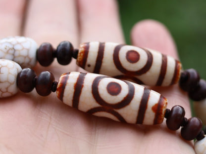 Big unique Wealth God Figure Dzi Bead bracelet combined with 4 eyes beads and Design. Perfect for having good vibes with style!