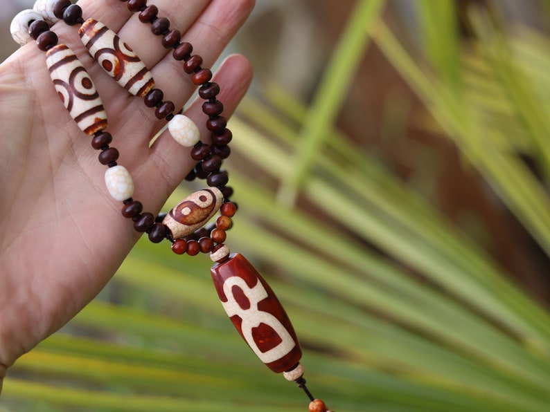 Big unique Wealth God Figure Dzi Bead bracelet combined with 4 eyes beads and Design. Perfect for having good vibes with style!
