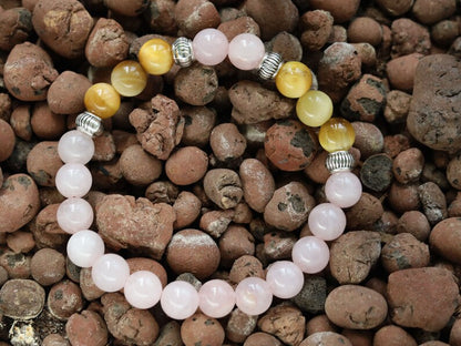 Gahiṇā Jewel Collection - Surprising Bracelet with Gold Tiger Eye and Rose quartz. Tribal Silver Plated Spacer Beads. Meaningful