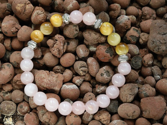 Gahiṇā Jewel Collection - Surprising Bracelet with Gold Tiger Eye and Rose quartz. Tribal Silver Plated Spacer Beads. Meaningful