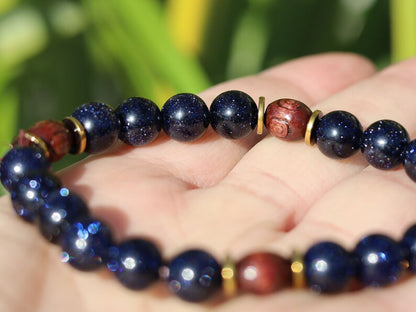 Goldstone combined with wooden beads with engraved stylized spiral decoration and Heishi beads: real (light magnetic) Hematite