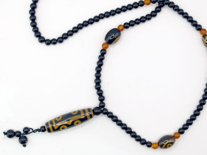 Amazing Seven Eye Dzi Beaded necklace. About a balanced life filled with blessings from the seven different aspirations in life.