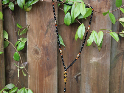 Amazing Seven Eye Dzi Beaded necklace. About a balanced life filled with blessings from the seven different aspirations in life.