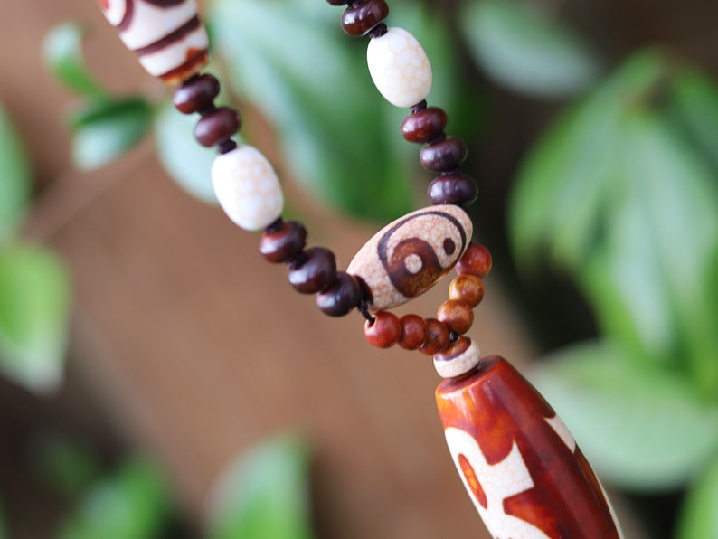 Big unique Wealth God Figure Dzi Bead bracelet combined with 4 eyes beads and Design. Perfect for having good vibes with style!