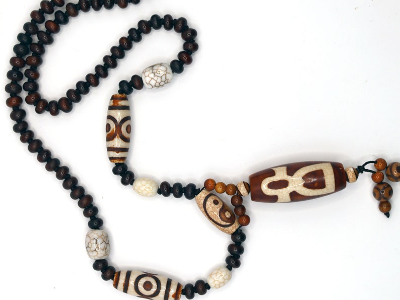 Big unique Wealth God Figure Dzi Bead bracelet combined with 4 eyes beads and Design. Perfect for having good vibes with style!