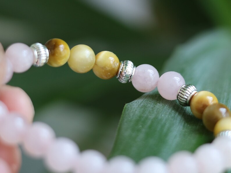 Gahiṇā Jewel Collection - Surprising Bracelet with Gold Tiger Eye and Rose quartz. Tribal Silver Plated Spacer Beads. Meaningful