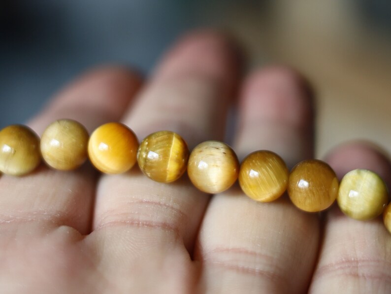 Gahiṇā Jewel Collection - Admirable Bracelet with Gold Tiger’s Eye with Top quality rose quartz with Tribal Silver Plated Spacer Beads.