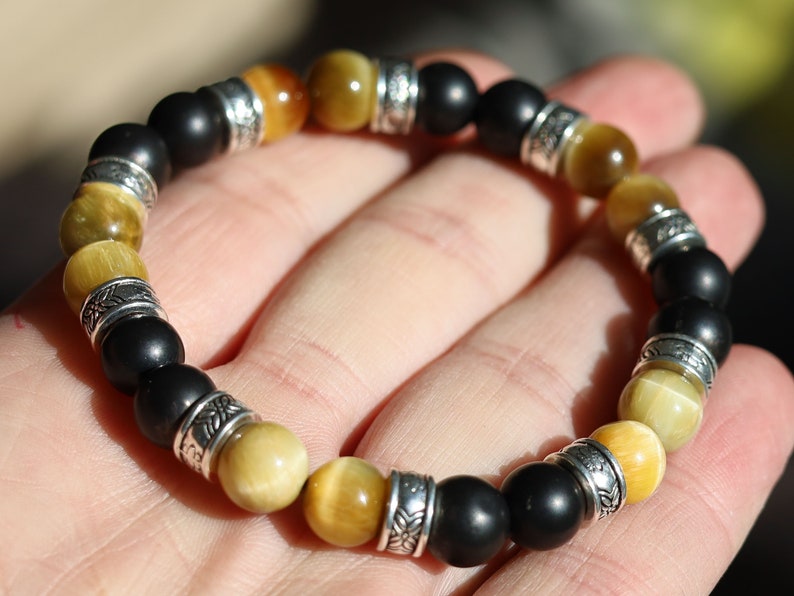 Gahiṇā Jewel Collection - Cool Bracelet with real Shungite and Gold Tiger Eye. Tribal Silver Plated Spacer Beads. Mindfully made