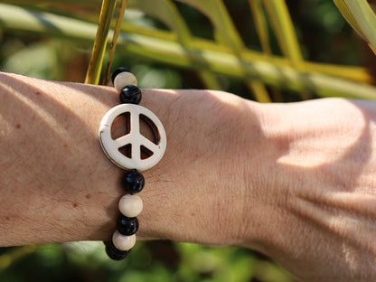 Viśēśa Jewel Collection - WORLD PEACE bracelet with White Jasper, black Onyx.  It also opens, heals, and activates the Root Chakra.