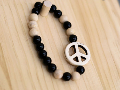 Viśēśa Jewel Collection - WORLD PEACE bracelet with White Jasper, black Onyx.  It also opens, heals, and activates the Root Chakra.