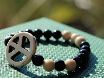 Viśēśa Jewel Collection - WORLD PEACE bracelet with White Jasper, black Onyx.  It also opens, heals, and activates the Root Chakra.