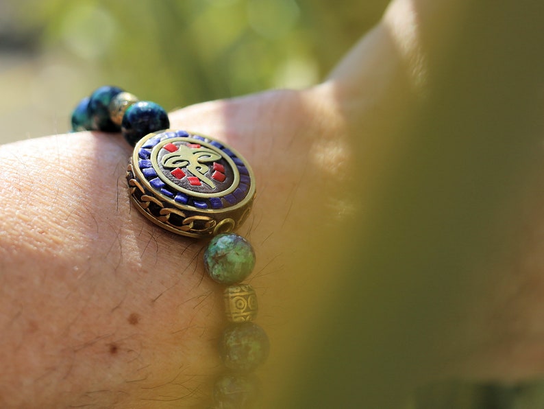 Viśēśa Jewel Collection - Miraculous Buddha eyes Blue Jade  bracelet. These eyes look in four directions to symbolize his wisdom.