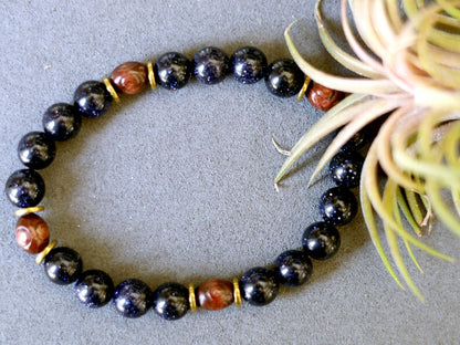 Goldstone combined with wooden beads with engraved stylized spiral decoration and Heishi beads: real (light magnetic) Hematite