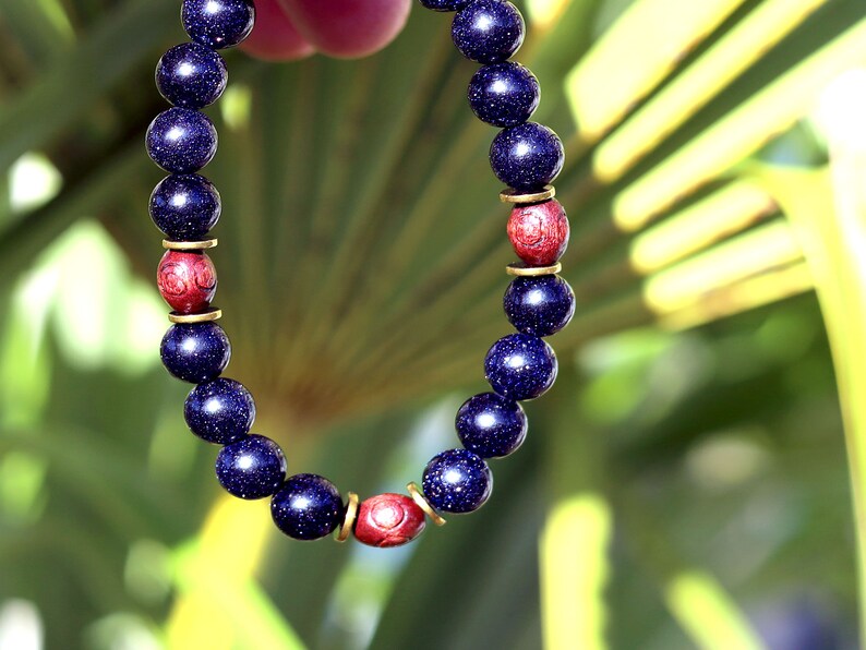Goldstone combined with wooden beads with engraved stylized spiral decoration and Heishi beads: real (light magnetic) Hematite