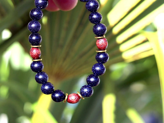 Goldstone combined with wooden beads with engraved stylized spiral decoration and Heishi beads: real (light magnetic) Hematite