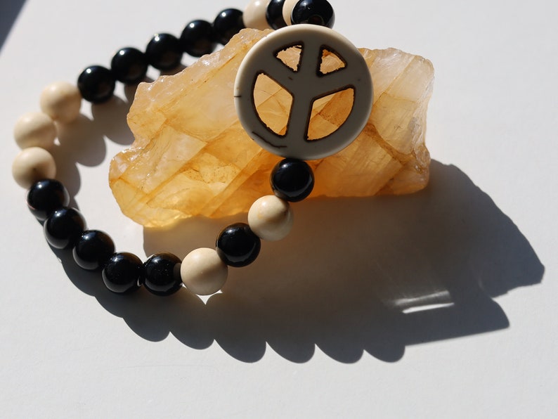 Viśēśa Jewel Collection - WORLD PEACE bracelet with White Jasper, black Onyx.  It also opens, heals, and activates the Root Chakra.