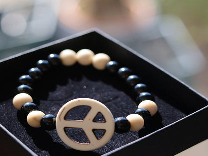 Viśēśa Jewel Collection - WORLD PEACE bracelet with White Jasper, black Onyx.  It also opens, heals, and activates the Root Chakra.