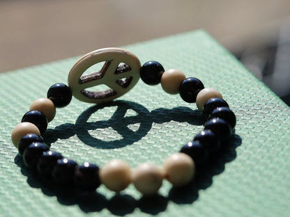 Viśēśa Jewel Collection - WORLD PEACE bracelet with White Jasper, black Onyx.  It also opens, heals, and activates the Root Chakra.