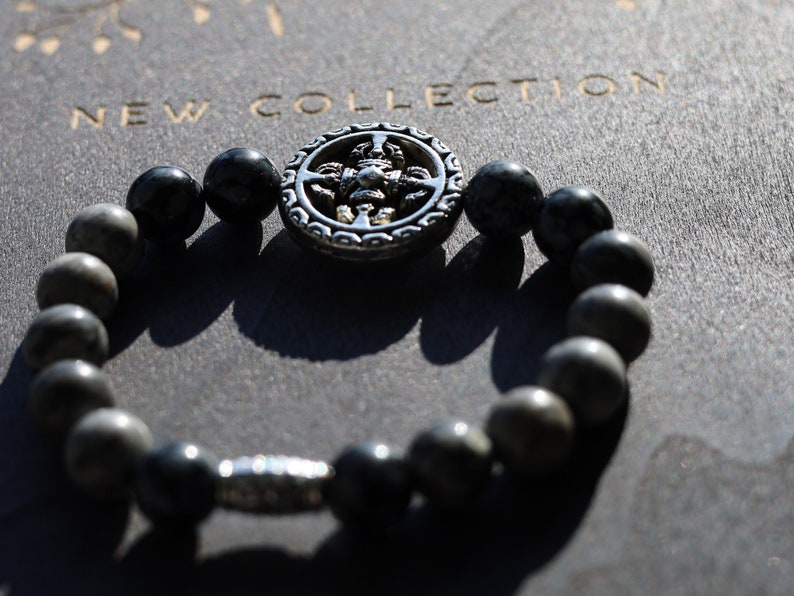 Viśēśa Jewel Collection - Awesome Buddhist Jewelry bracelet. Bracelet made with  different beads. Snowflake Obisidan and Silver Leaf Jasper.