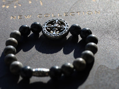 Viśēśa Jewel Collection - Awesome Buddhist Jewelry bracelet. Bracelet made with  different beads. Snowflake Obisidan and Silver Leaf Jasper.