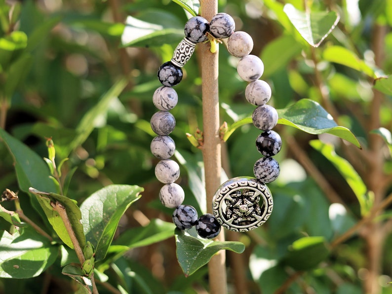 Viśēśa Jewel Collection - Awesome Buddhist Jewelry bracelet. Bracelet made with  different beads. Snowflake Obisidan and Silver Leaf Jasper.