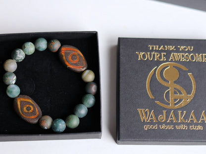 Awful dZi  Indian Agate Two-eye dZi bead bracelet 10mm. With a beautiful Wajakaa ECO jewelry box. Consist of FSC®-certified cardboard