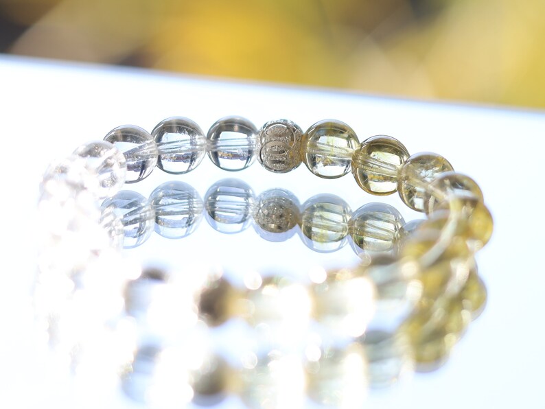 Sterling 925 Silver - Rock crystal and Golden Rutilated Quartz bracelet with 2 beautiful Silver Matte Round Beads.