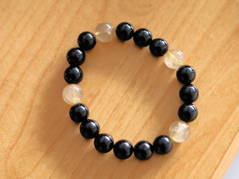 bLACKLINE SERIES Black Agate/  beautiful Rutilated quartz bracelets. Enhances creativity , the intellect, making it a beneficial stone