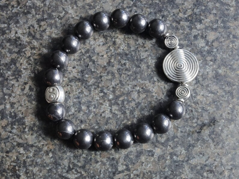 bLACKLINE SERIES Shungite bracelets combined with The Universe Spiral. Reach harmony between your body and soul.