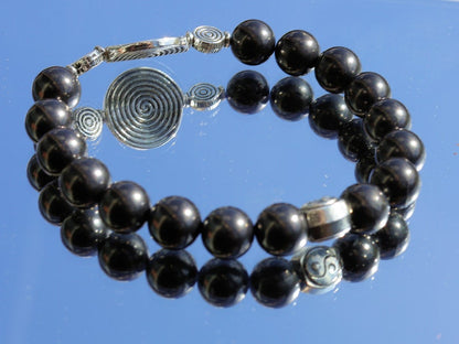 bLACKLINE SERIES Shungite bracelets combined with The Universe Spiral. Reach harmony between your body and soul.