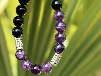 Unfrequent Amethyst crystal bracelet with Black Agate.  Connect to your inner peace and leave the rest behind.