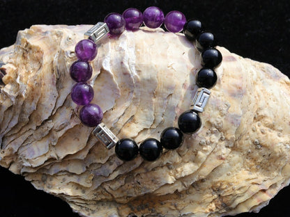 Unfrequent Amethyst crystal bracelet with Black Agate.  Connect to your inner peace and leave the rest behind.
