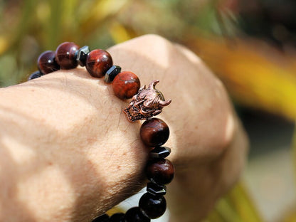 Enticing RED Tiger's Eye crystal combined with Devil Style Alloy Bead. Red Tiger Eye, or Dragon’s Eye, is Tiger Eye with red shades and hues