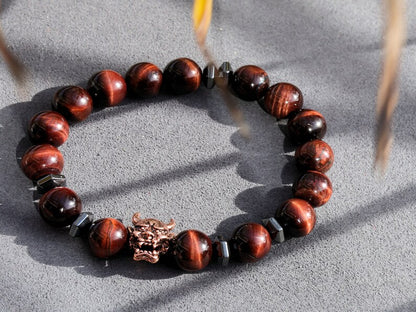 Enticing RED Tiger's Eye crystal combined with Devil Style Alloy Bead. Red Tiger Eye, or Dragon’s Eye, is Tiger Eye with red shades and hues