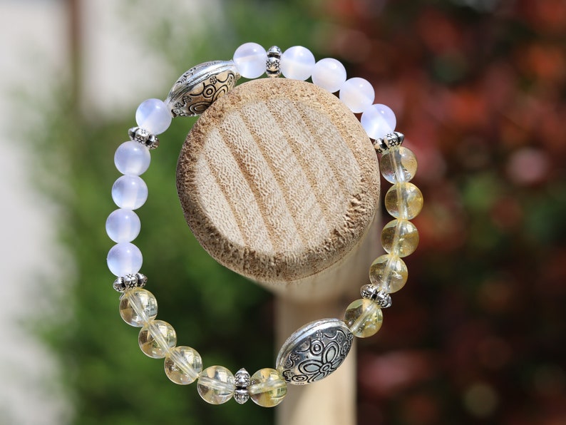 Intrinsic Natural Top Grade White Moonstone Cat Eye Selenite with the Citrine stone.  bright and happy energy fills your spirit