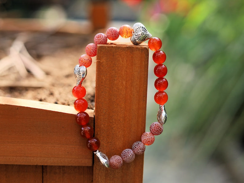 Subliminal Carnelian combined with Matte Frosted Agate Beads and beautiful Tibetan Style Carved Heart. Efficient, positive communication.