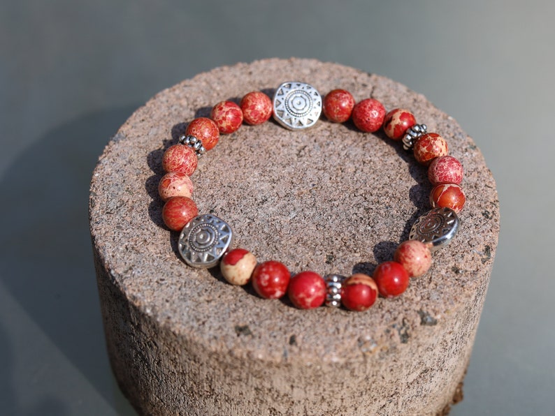 Shine Natural Sea Sediment Red Jasper with Sun Patterns.  Represents the highest form of intelligence, spiritual intelligence.